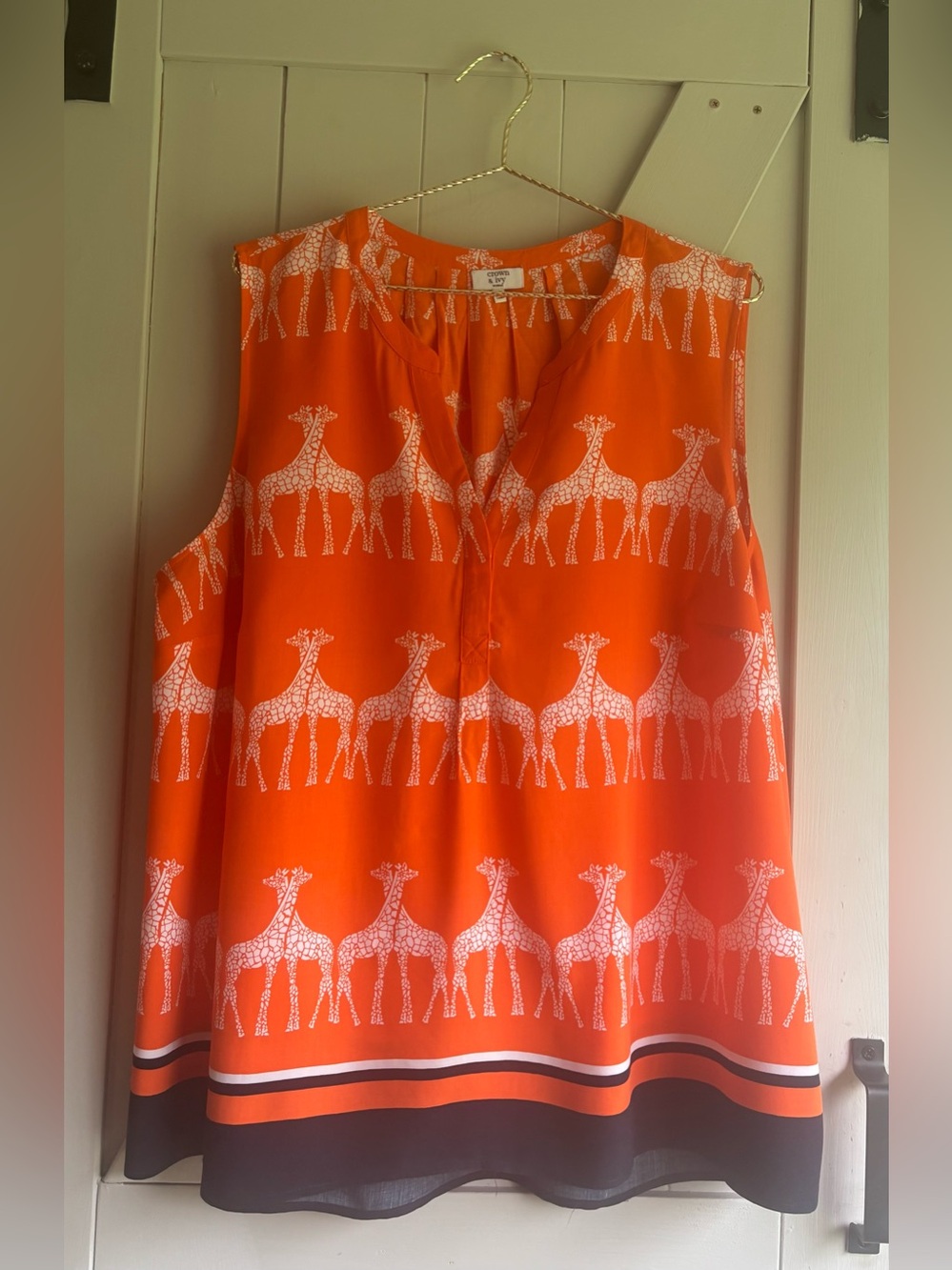 Crown & Ivy Bright Orange and Navy Sleeveless Giraffe Print Top